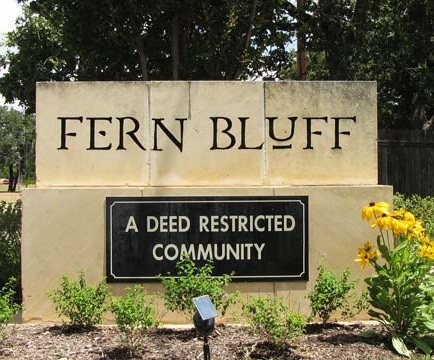 Picture of a large stone entrance sign for Fern Bluff neighborhood.
