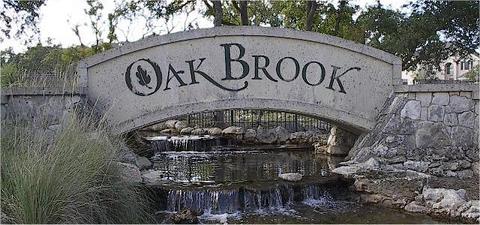 Picture of a large stone bridge sign for Oak Brook neighborhood.