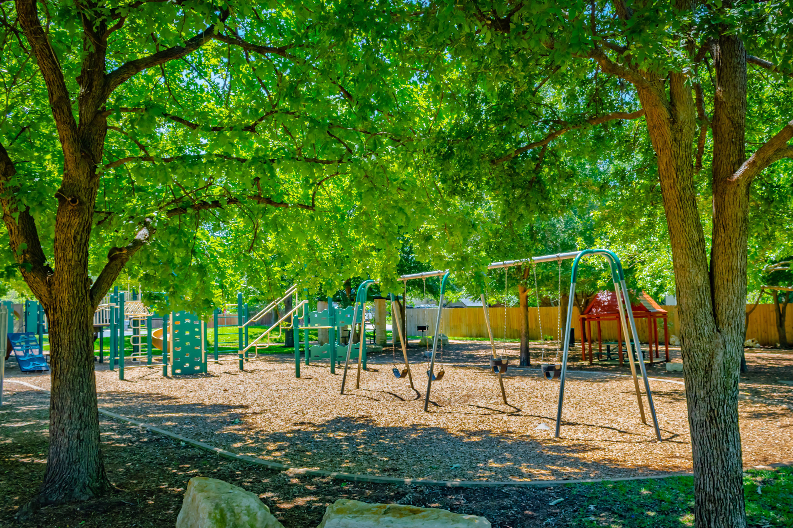Picture of the swings and playground at Fern Bluff Park.